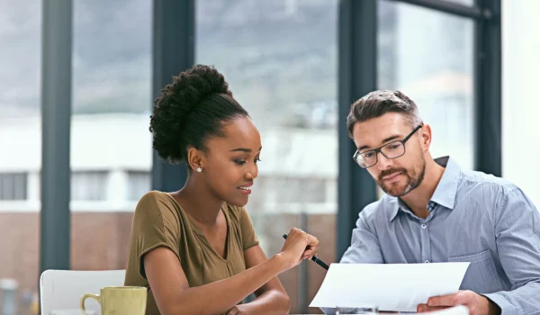 our-latest-reports-are-looking-positive-cropped-shot-two-colleagues-having-meeting-office